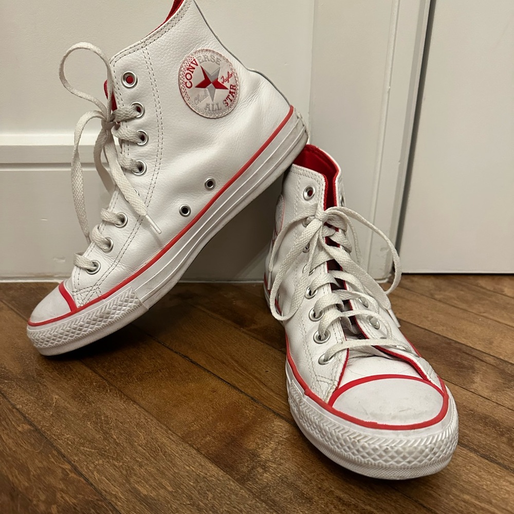 Converse All Star white leather sneakers with red trim. Size women’s 9